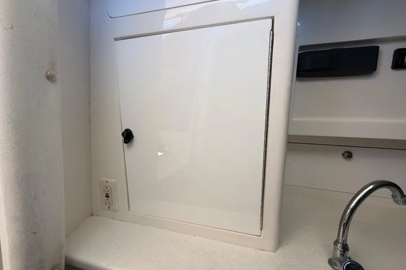 Slide: The Image of 2008 Intrepid 377 Walkaround interior with white cabinet and faucet. - 130