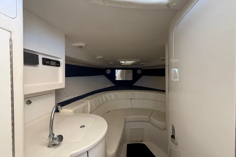 Slide: The Image of 2008 Intrepid 377 Walkaround cabin interior with seating and sink. - 132