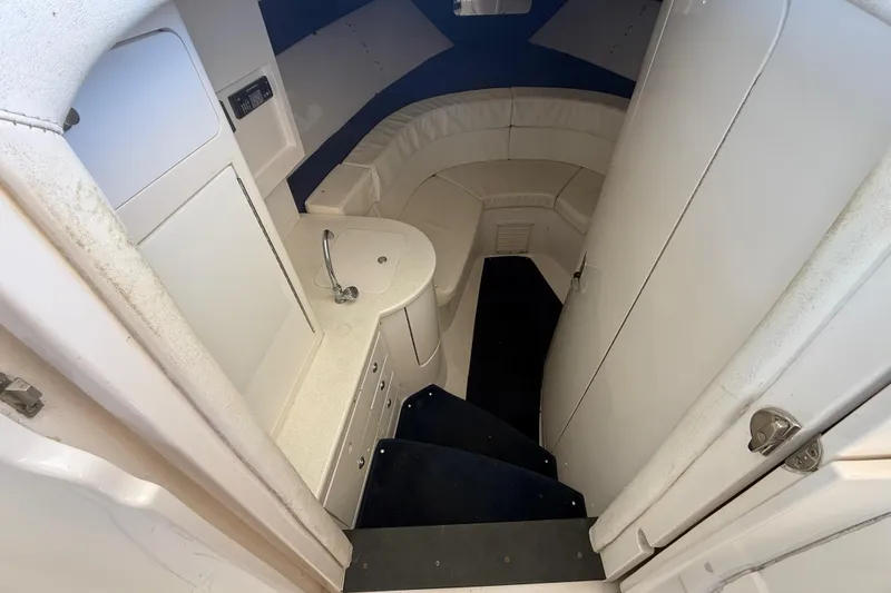 Slide: The Image of 2008 Intrepid 377 Walkaround cabin interior with seating and compact sink. - 134