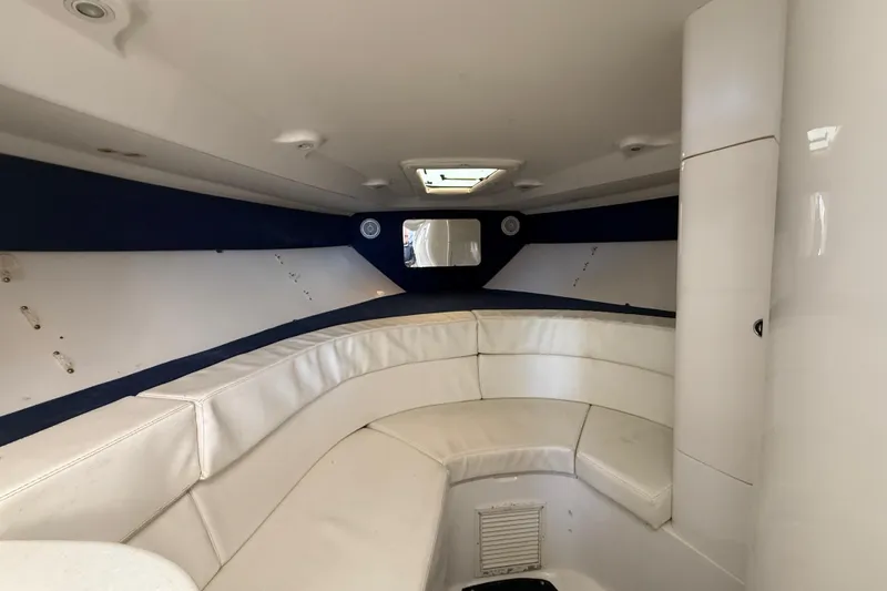 Slide: The Image of 2008 Intrepid 377 Walkaround cabin interior with white seating and overhead hatch. - 135