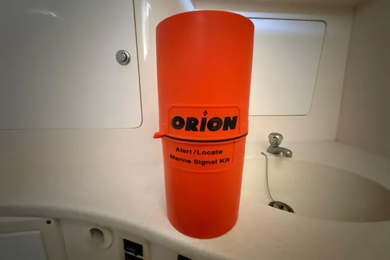 Slide: The Image of Orange marine signal kit on 2008 Intrepid 377 Walkaround boat's countertop. - 142