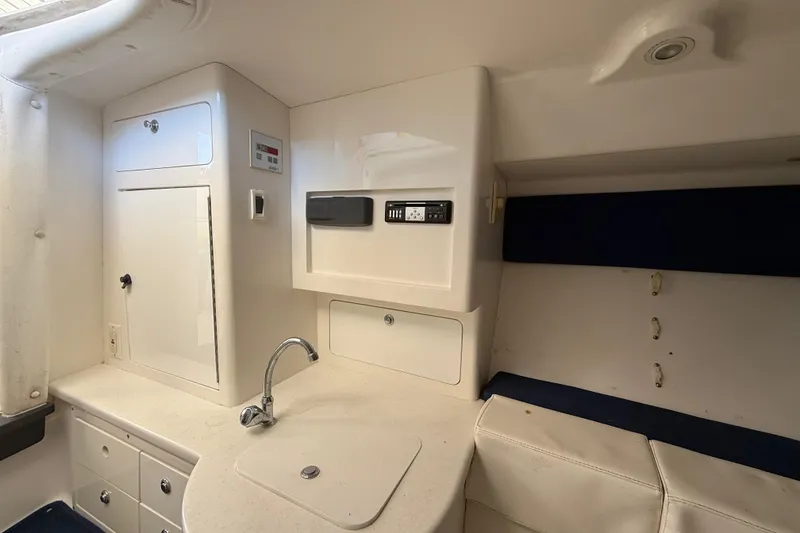 Slide: The Image of 2008 Intrepid 377 Walkaround cabin interior with sink and storage cabinets. - 155
