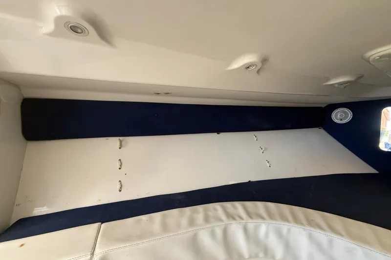 Slide: The Image of Interior view of a 2008 Intrepid 377 Walkaround boat cabin with seating. - 163