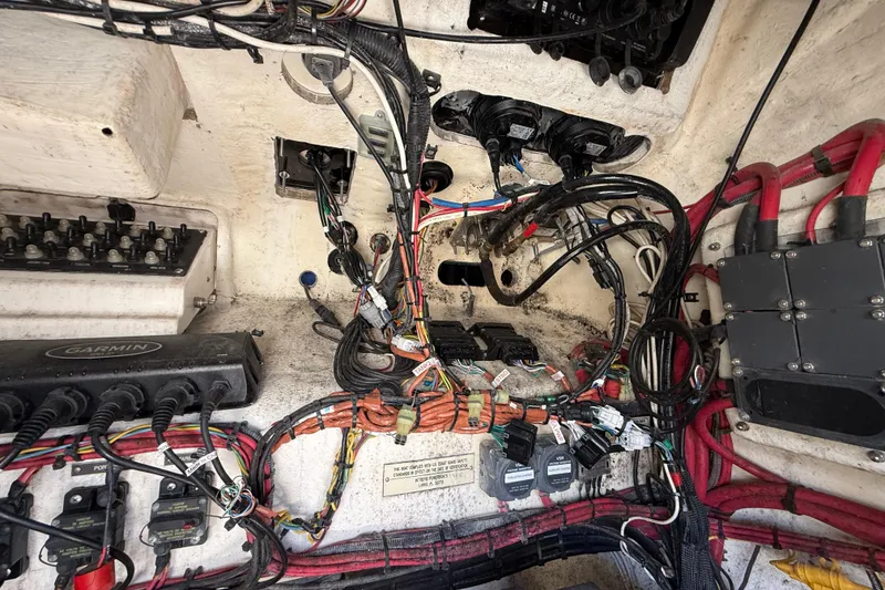 Slide: The Image of 2008 Intrepid 377 Walkaround boat wiring and electrical components in engine compartment. - 172