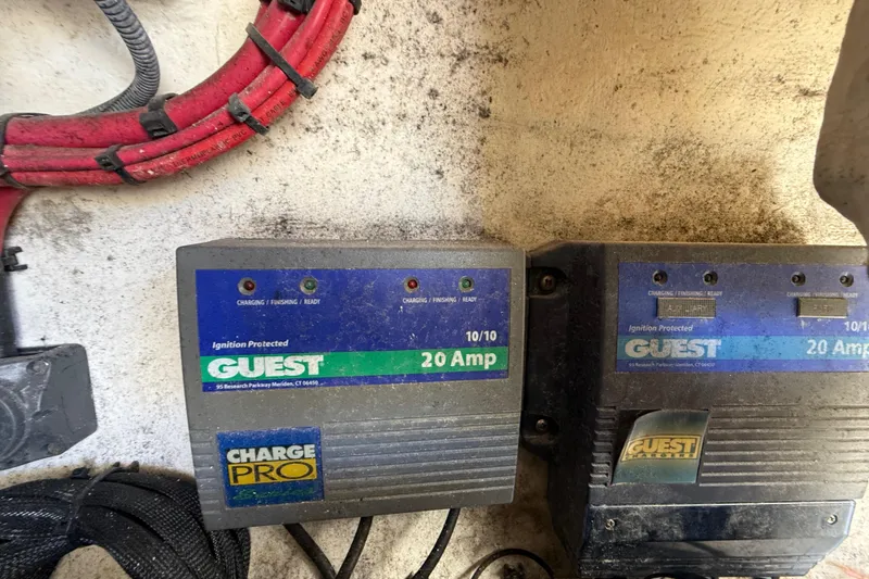 Slide: The Image of Battery chargers in a 2008 Intrepid 377 Walkaround boat, featuring Guest Charge Pro units. - 174