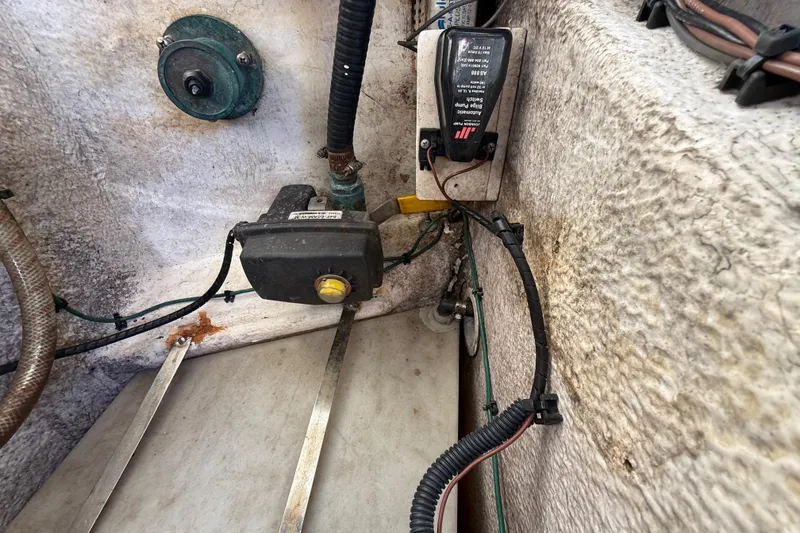 Slide: The Image of 2008 Intrepid 377 Walkaround bilge area with pump and wiring components. - 184