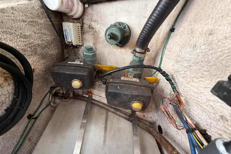 Slide: The Image of 2008 Intrepid 377 Walkaround engine compartment with wiring and mechanical components. - 185