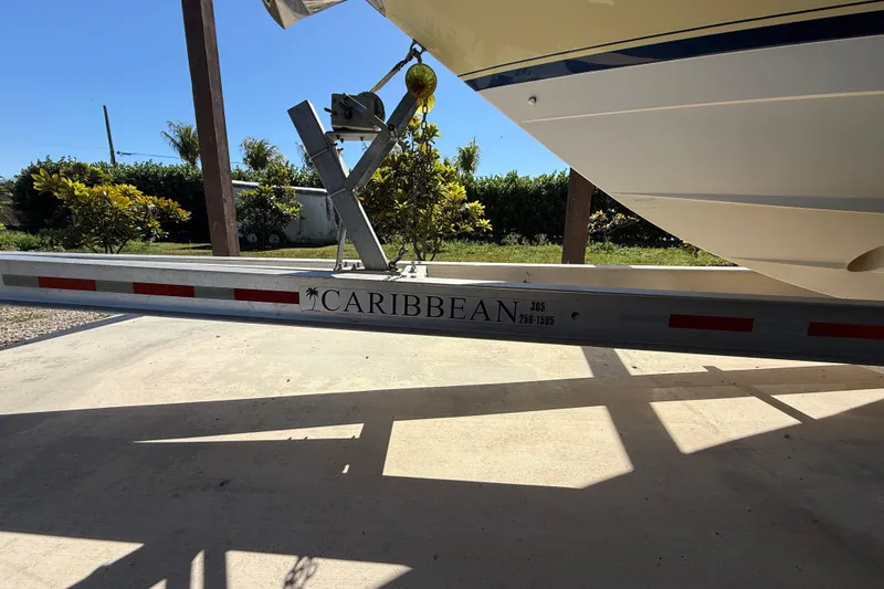 Slide: The Image of 2008 Intrepid 377 Walkaround boat on Caribbean trailer, outdoor setting. - 189