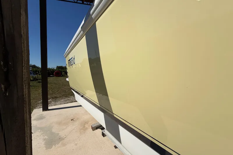 Slide: The Image of 2008 Intrepid 377 Walkaround boat side view in outdoor setting. - 19