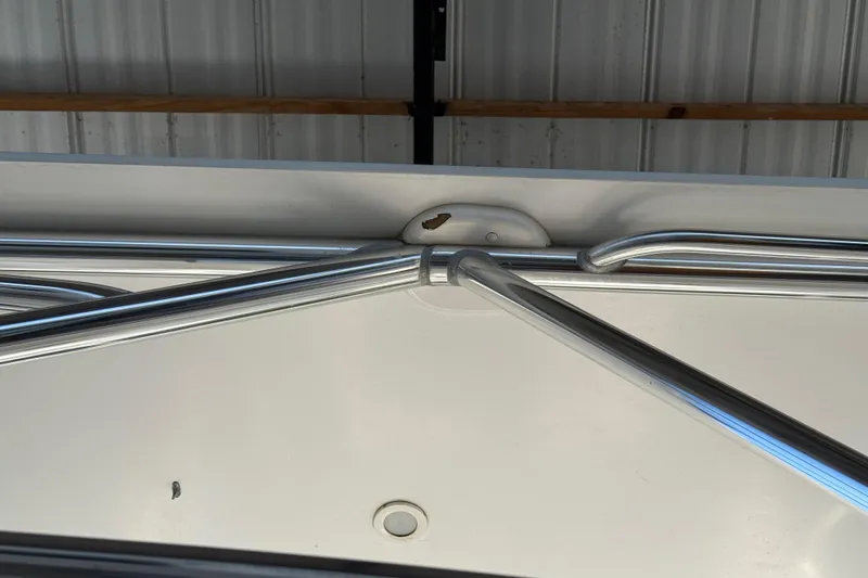 Slide: The Image of 2008 Intrepid 377 Walkaround boat railing detail in a storage facility. - 194