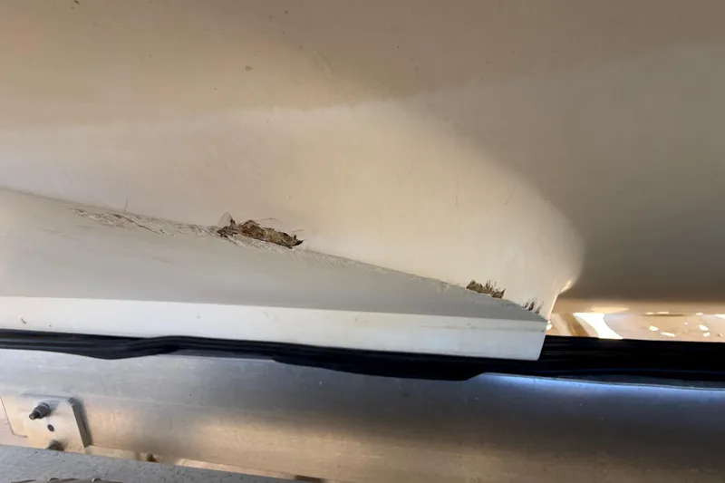 Slide: The Image of Damaged hull of 2008 Intrepid 377 Walkaround boat showing visible cracks. - 195