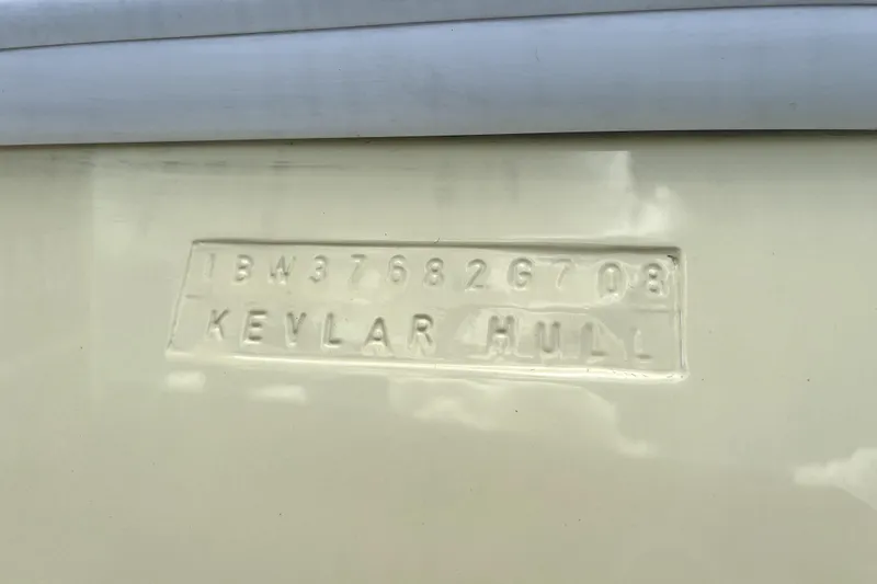 Slide: The Image of 2008 Intrepid 377 Walkaround boat on trailer under shelter, side view. - 2