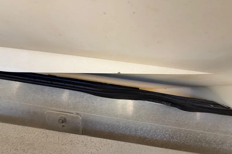 Slide: The Image of Close-up of 2008 Intrepid 377 Walkaround boat hull and trailer detail. - 208