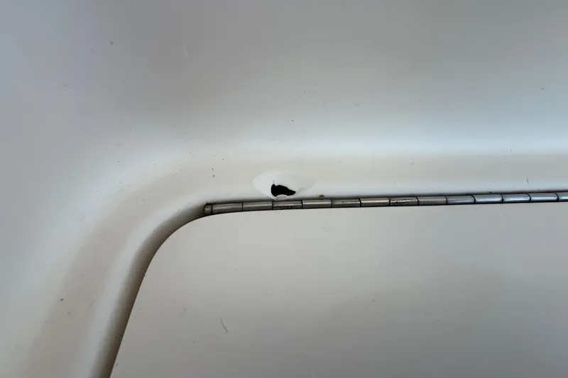 Slide: The Image of Close-up of a hinge on a 2008 Intrepid 377 Walkaround boat. - 215