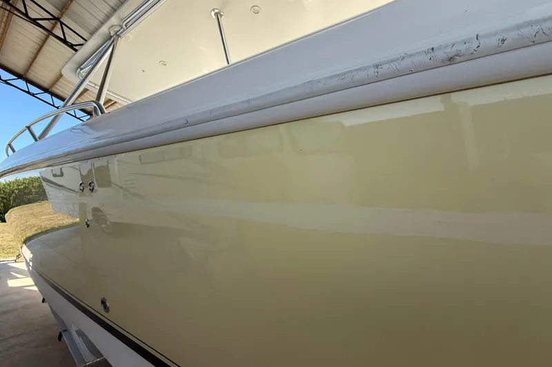 Slide: The Image of 2008 Intrepid 377 Walkaround boat side view under shelter. - 218