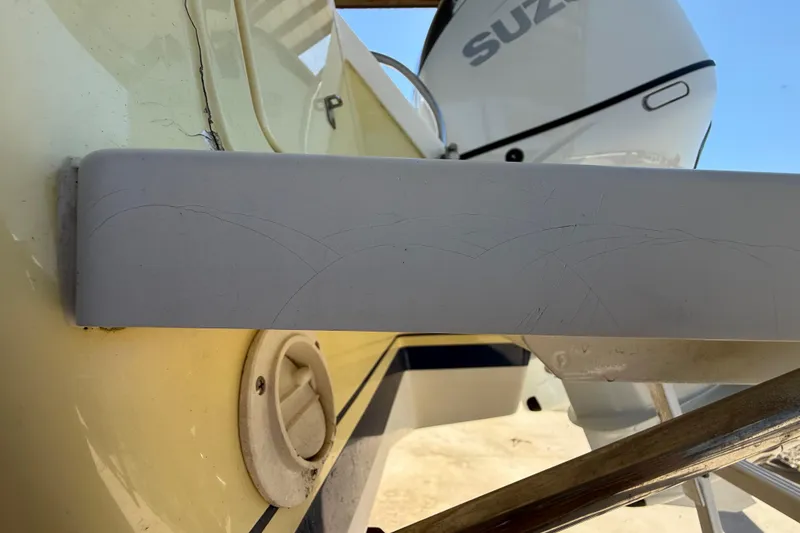 Slide: The Image of 2008 Intrepid 377 Walkaround boat detail with Suzuki engine in background. - 220