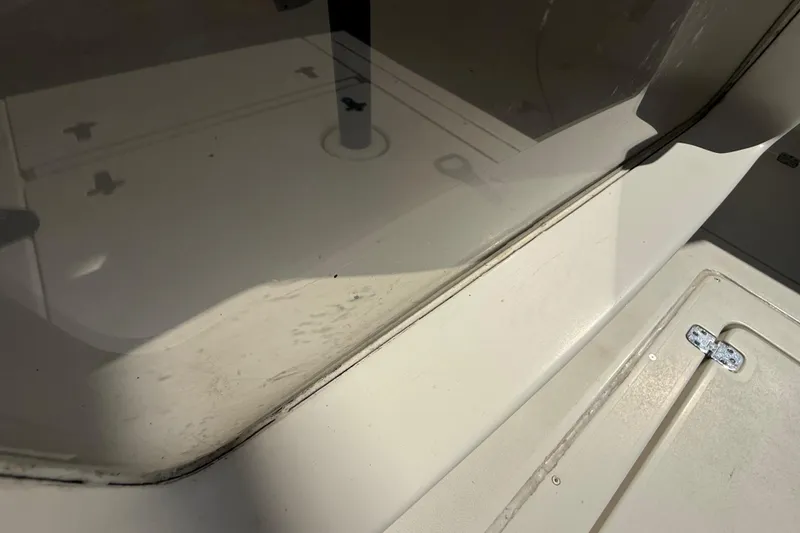 Slide: The Image of Close-up of 2008 Intrepid 377 Walkaround boat deck with visible hatch and fittings. - 229