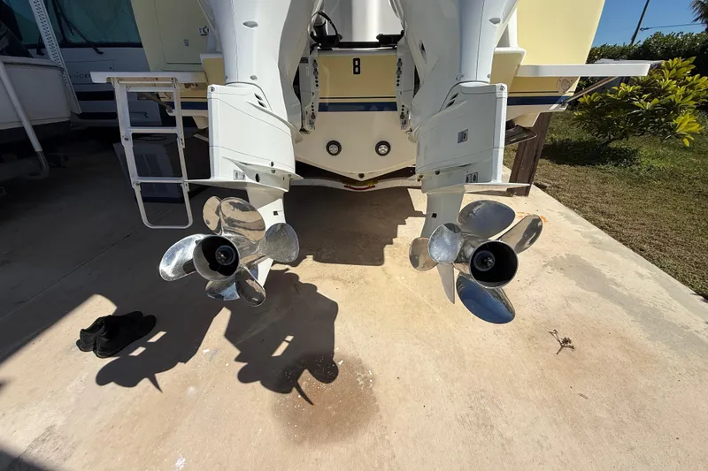 Slide: The Image of 2008 Intrepid 377 Walkaround boat with dual outboard motors and propellers. - 27