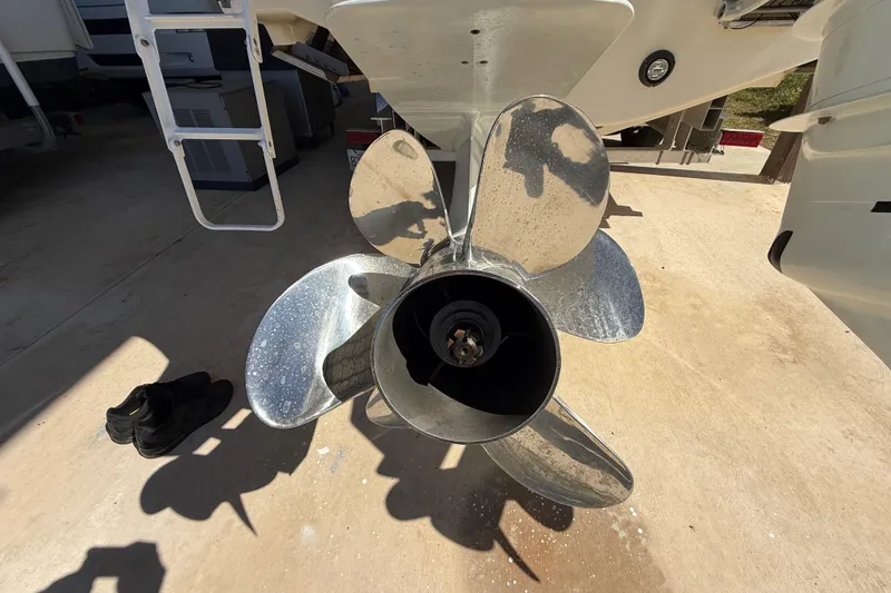 Slide: The Image of Propeller of a 2008 Intrepid 377 Walkaround boat on a concrete surface. - 31