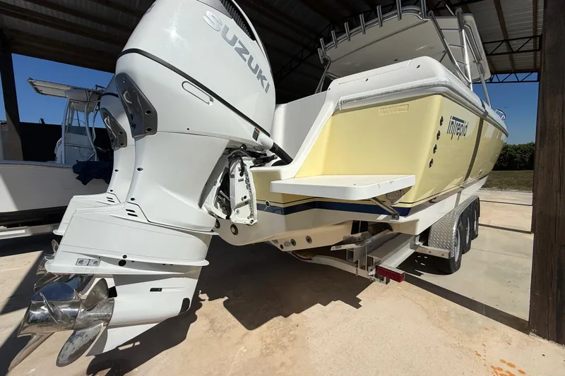Slide: The Image of 2008 Intrepid 377 Walkaround boat with Suzuki outboard engine on trailer. - 33