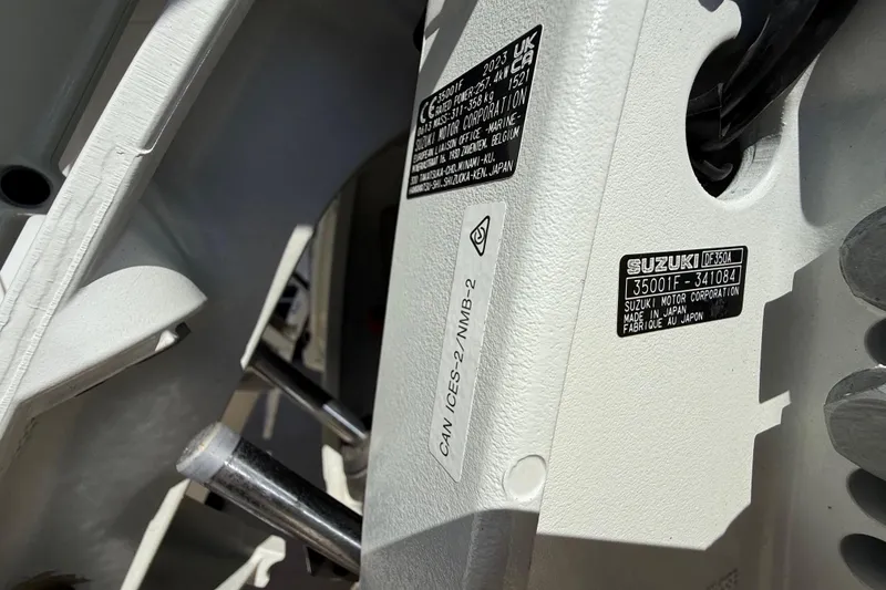 Slide: The Image of Close-up of a 2008 Intrepid 377 Walkaround engine with Suzuki labels and serial numbers. - 34