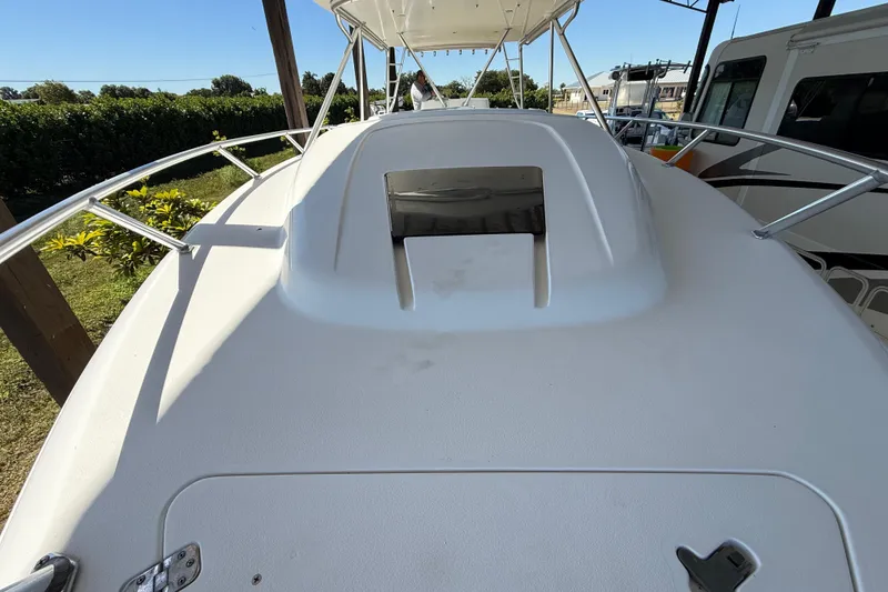 Slide: The Image of 2008 Intrepid 377 Walkaround boat deck with railing and hatch, outdoors. - 44