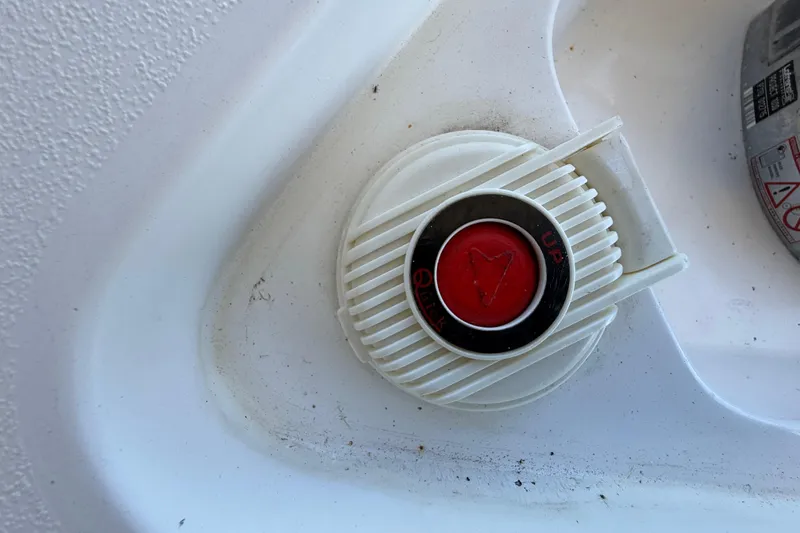 Slide: The Image of Red button on a 2008 Intrepid 377 Walkaround boat, labeled "Quick" and "Up." - 48