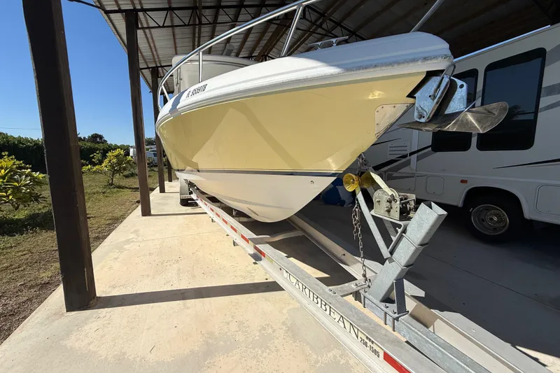 Slide: The Image of 2008 Intrepid 377 Walkaround boat on trailer under shelter, side view. - 5