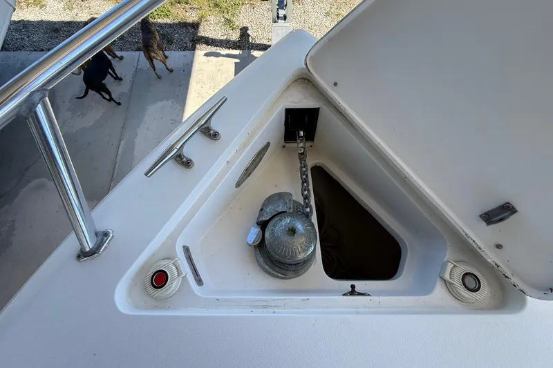 Slide: The Image of 2008 Intrepid 377 Walkaround anchor compartment with chain and winch. - 51