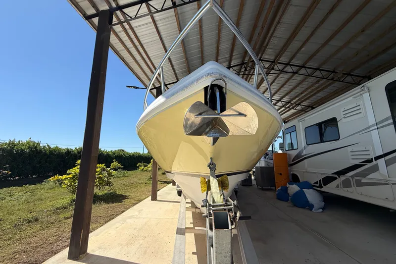 Slide: The Image of 2008 Intrepid 377 Walkaround boat on trailer under shelter, side view. - 6