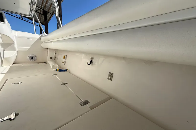 Slide: The Image of 2008 Intrepid 377 Walkaround boat interior with storage compartments and seating. - 67