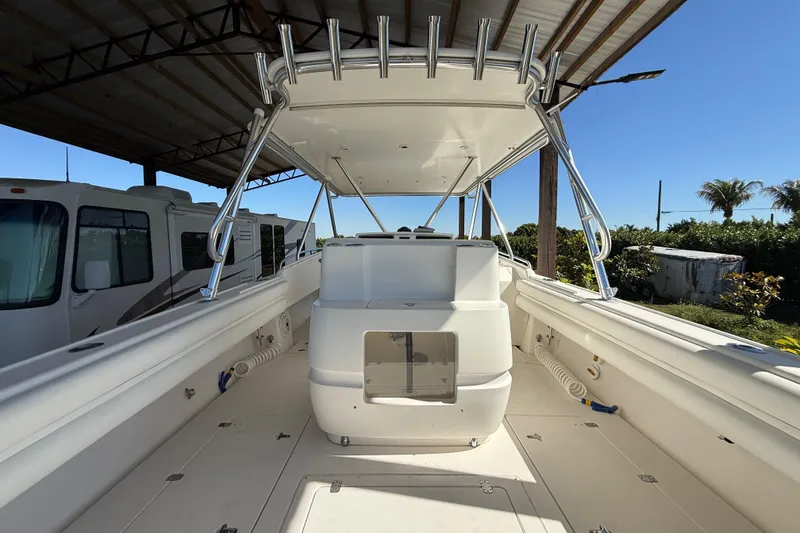 Slide: The Image of 2008 Intrepid 377 Walkaround boat interior under a covered structure. - 69