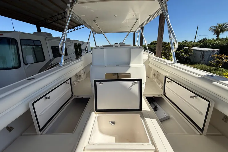 Slide: The Image of 2008 Intrepid 377 Walkaround boat interior with open storage compartments. - 75