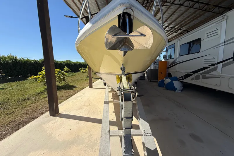 Slide: The Image of 2008 Intrepid 377 Walkaround boat on trailer under shelter, side view. - 8