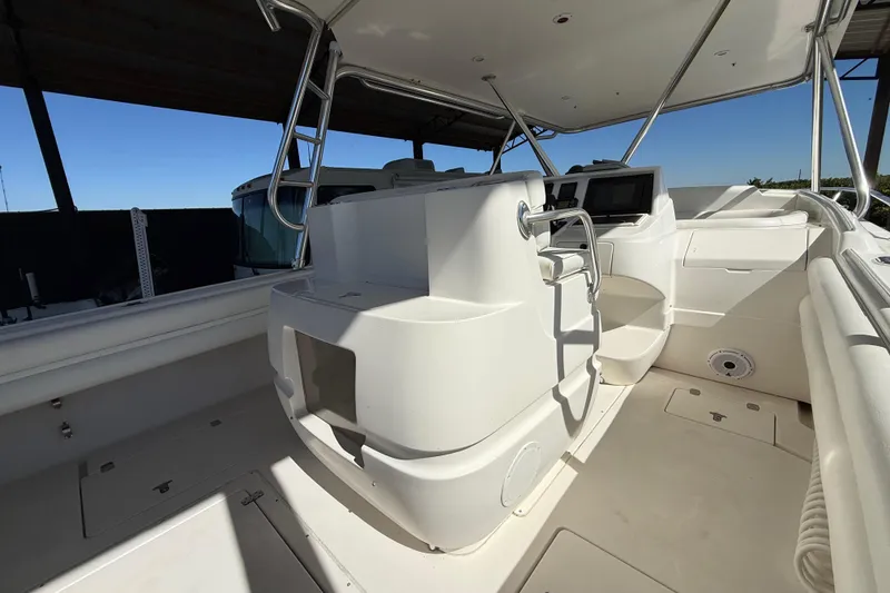 Slide: The Image of 2008 Intrepid 377 Walkaround boat interior with helm station and seating area. - 80