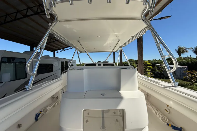 Slide: The Image of 2008 Intrepid 377 Walkaround boat interior with canopy and storage compartments. - 81