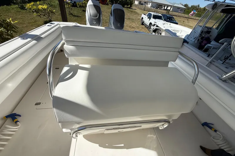 Slide: The Image of 2008 Intrepid 377 Walkaround boat interior with white seating and stainless steel railings. - 84