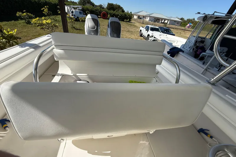 Slide: The Image of 2008 Intrepid 377 Walkaround boat interior with seating and dual engines. - 85