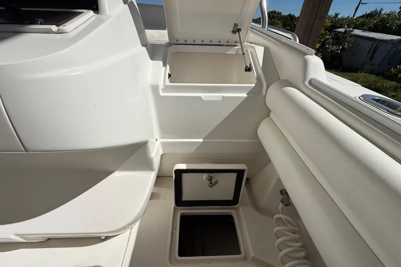 Slide: The Image of 2008 Intrepid 377 Walkaround interior with open storage compartments and seating. - 89