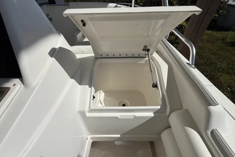 Slide: The Image of Open storage compartment on a 2008 Intrepid 377 Walkaround boat. - 90