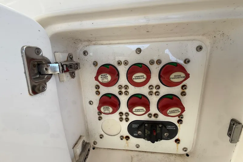 Slide: The Image of Control panel of a 2008 Intrepid 377 Walkaround boat with switches and circuit module. - 92