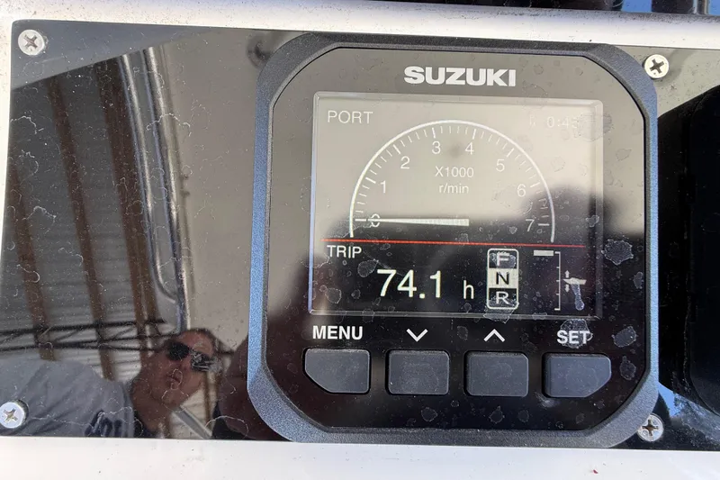 Slide: The Image of Suzuki engine display on 2008 Intrepid 377 Walkaround showing 74.1 hours. - 95