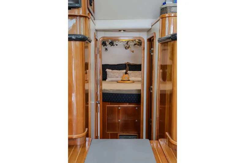 Slide: The Image of Luxurious cabin interior of 2001 Black Watch 40 yacht with polished wood finish. - 12