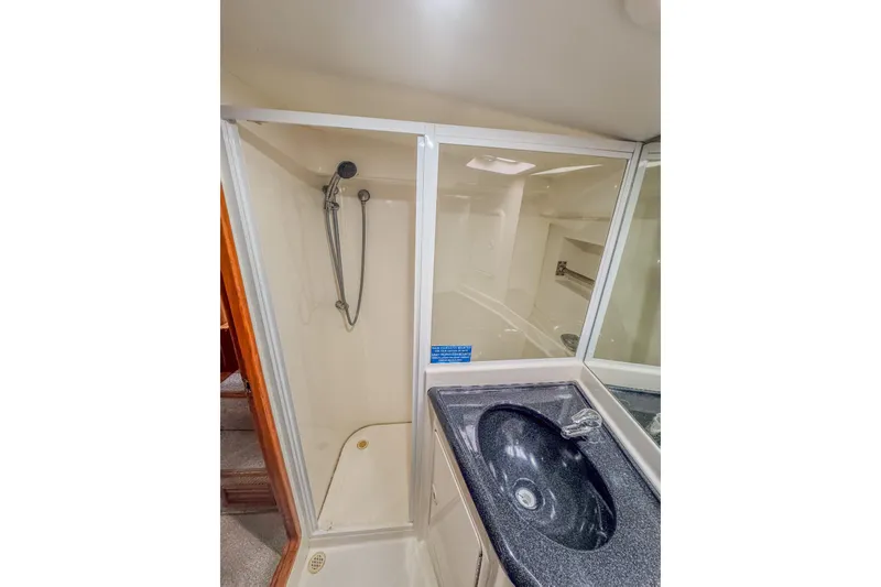 Slide: The Image of Bathroom interior of 2001 Black Watch 40 yacht with shower and sink. - 14