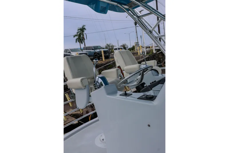 Slide: The Image of Helm of 2001 Black Watch 40 boat with dual seats and steering wheel. - 23
