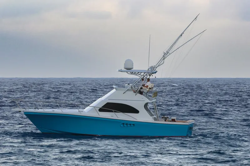 Slide: The Image of Blue 2001 Black Watch 40 yacht sailing on open sea under cloudy sky. - 3