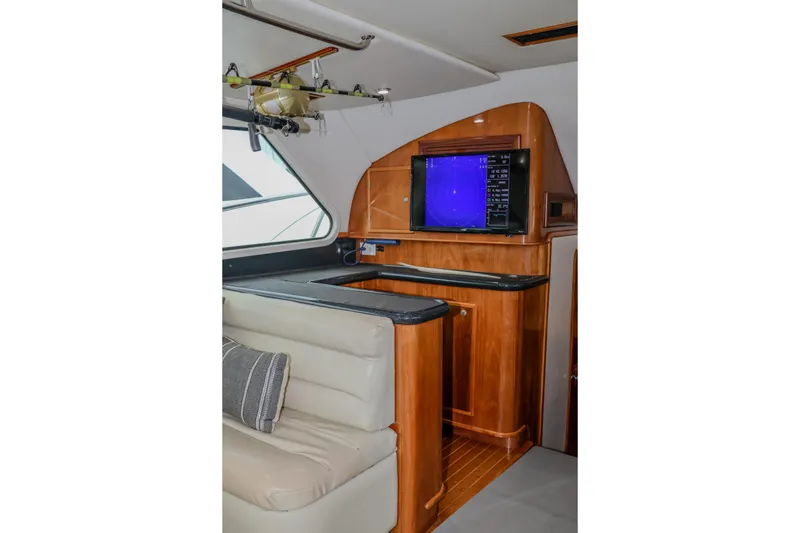 Slide: The Image of Interior of 2001 Black Watch 40 yacht with wood cabinetry and seating area. - 7
