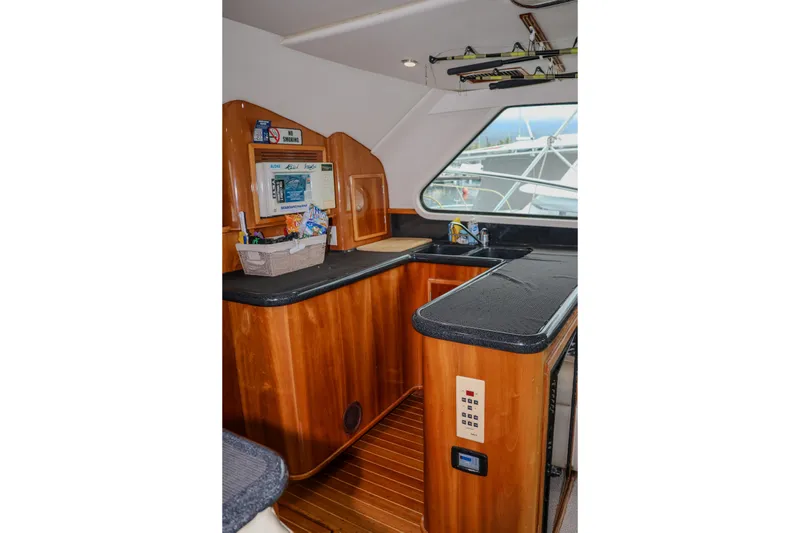 Slide: The Image of Interior of 2001 Black Watch 40 yacht with wooden cabinetry and modern amenities. - 8