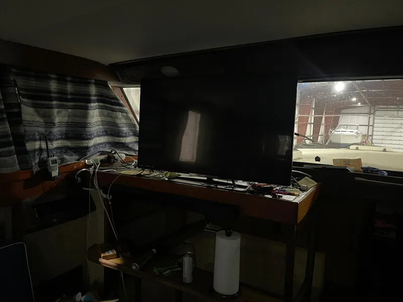 Slide: The Image of Interior of 1979 Viking 43 Double Cabin with TV and striped curtains. - 10