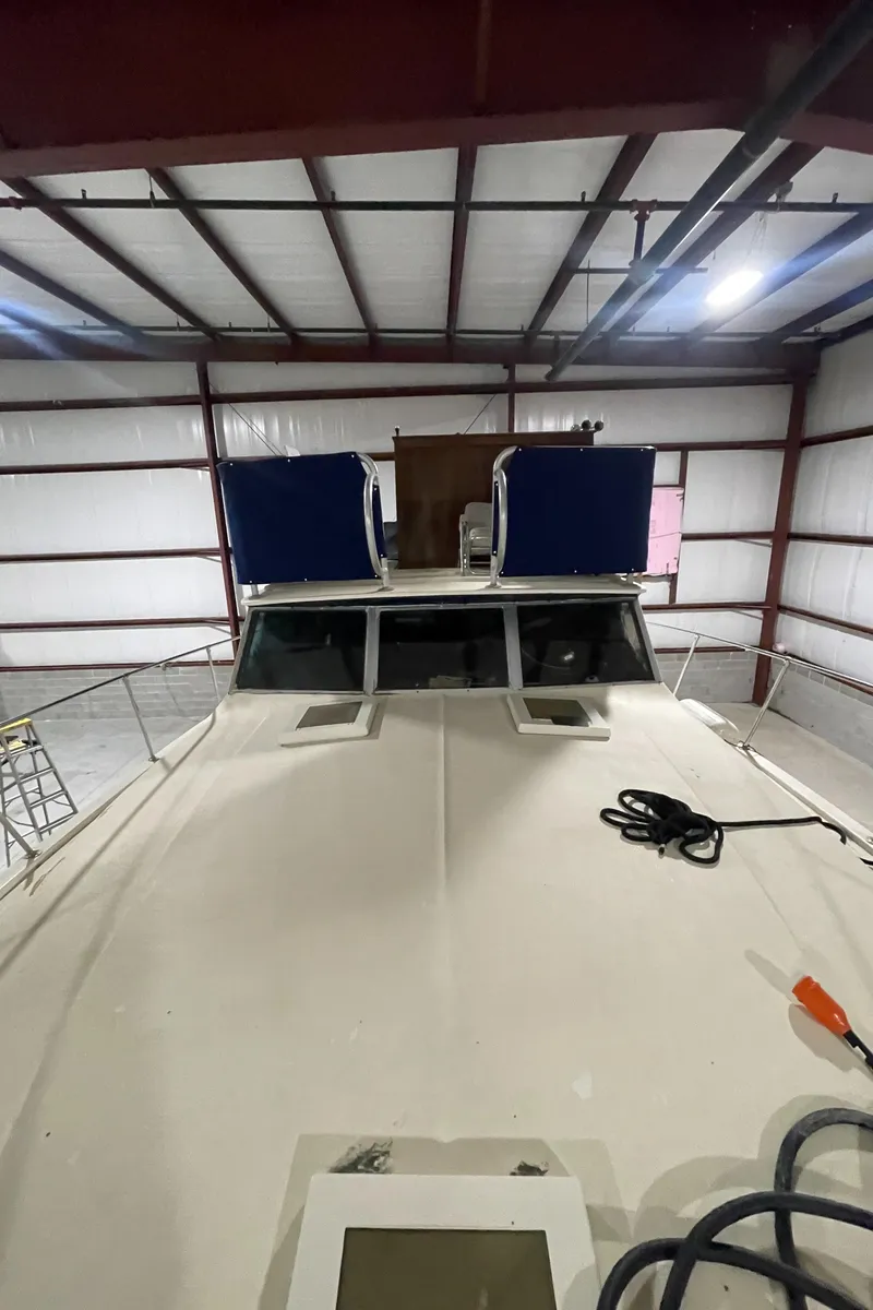 Slide: The Image of 1979 Viking 43 Double Cabin boat in storage, view of deck and cabin. - 13